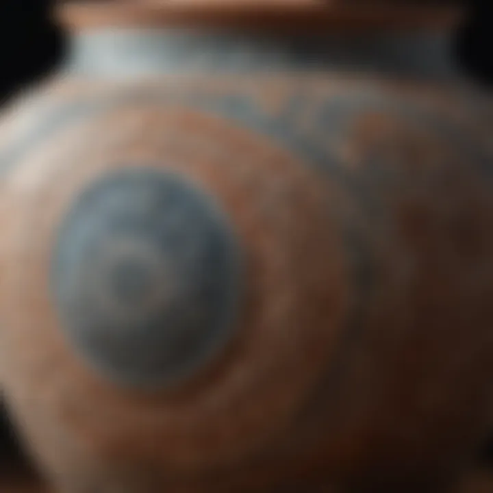 Close-up view of a handmade earthenware pot with intricate glaze patterns.