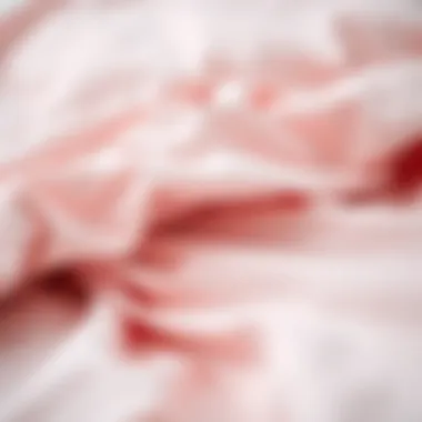 Close-up of soft fabric texture of light pink sheets