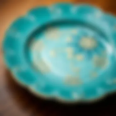 Close-up of a teal plate with intricate patterns