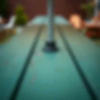 Close-up of an umbrella hole in a patio picnic table