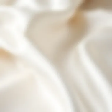 Close-up of soft white satin fabric texture