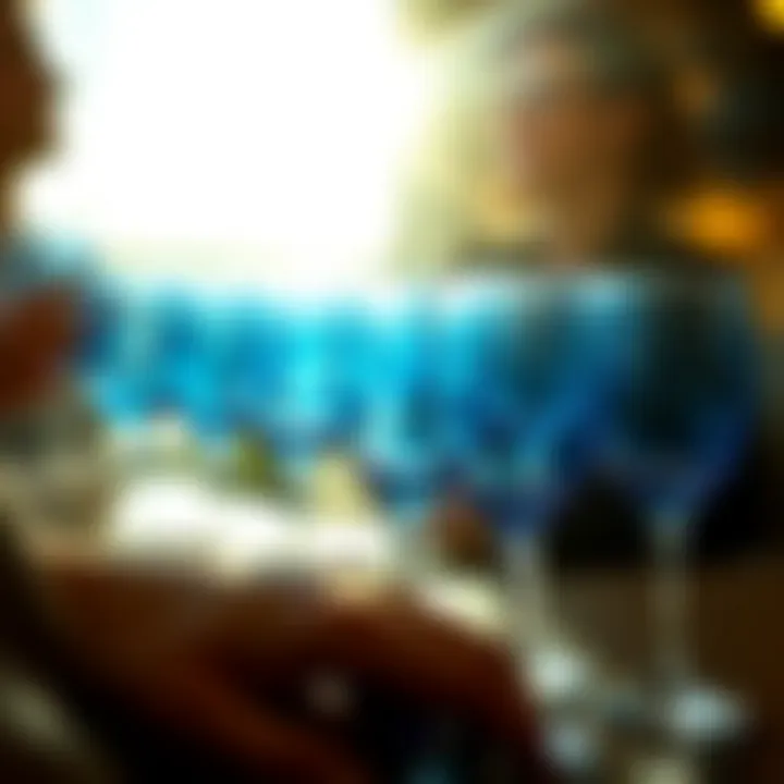 Group of blue wine glasses reflecting light at a social gathering