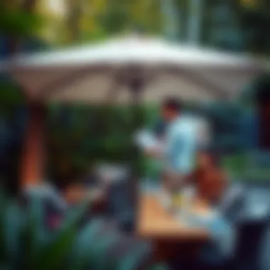 A cozy outdoor gathering under a large umbrella surrounded by lush greenery