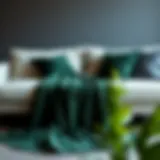 Luxurious dark green king blanket draped over a stylish sofa