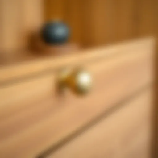 Elegant three-inch gold drawer pull on a wooden cabinet