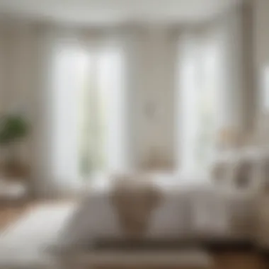 Bright bedroom adorned with white sheer grommet curtains